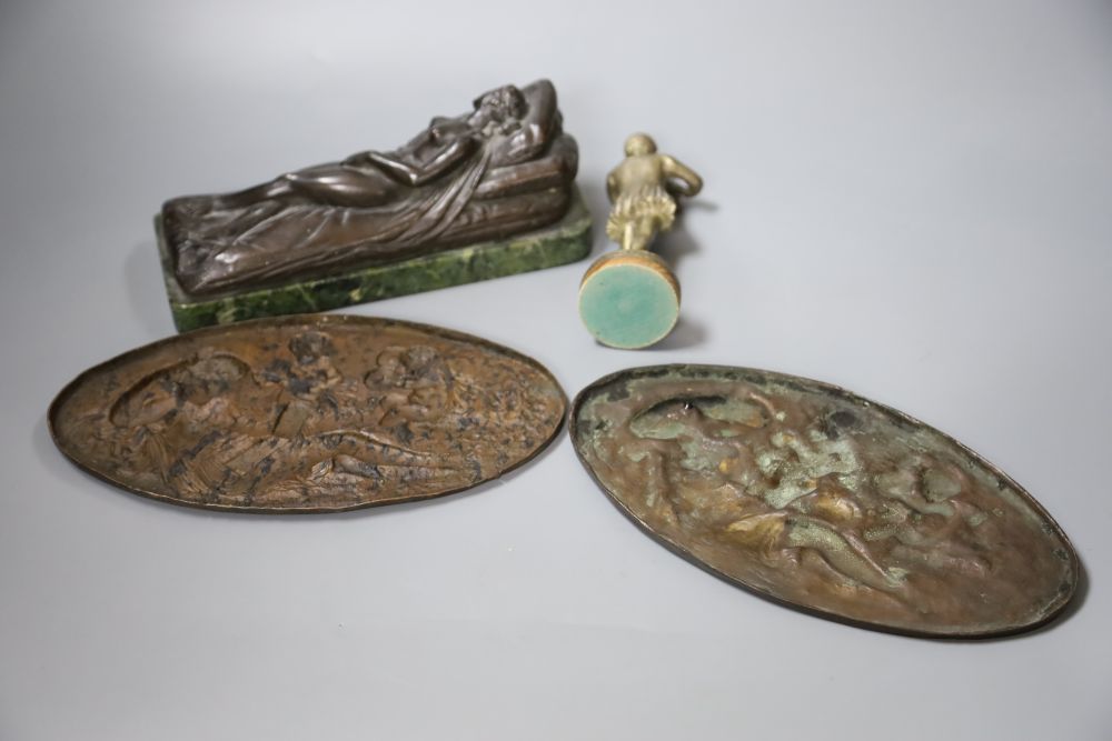 A bronze of a reclining female nude, a pair of plaques and a boy musician